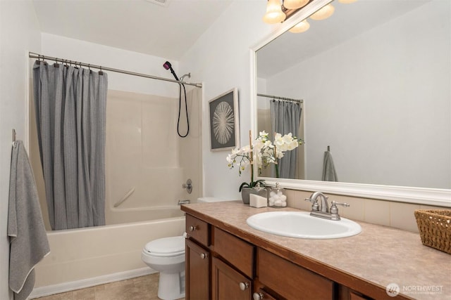 bathroom with toilet, shower / bath combo, and vanity