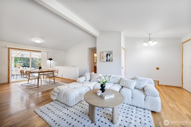 living area with vaulted ceiling with beams, light wood-type flooring, a chandelier, and visible vents