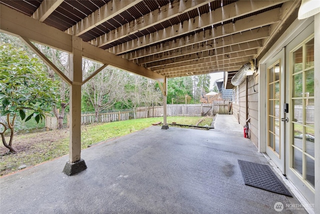 view of patio with french doors and a fenced backyard