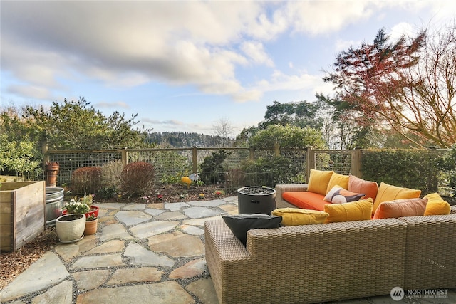 view of patio / terrace featuring an outdoor hangout area and fence