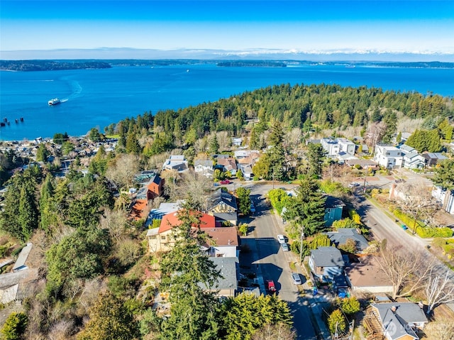 aerial view with a water view, a forest view, and a residential view