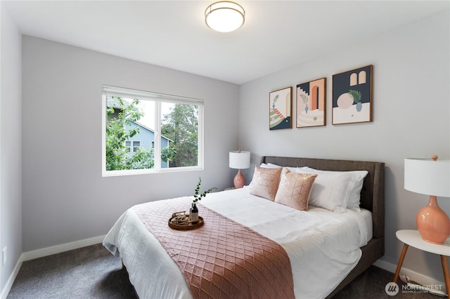 carpeted bedroom featuring baseboards