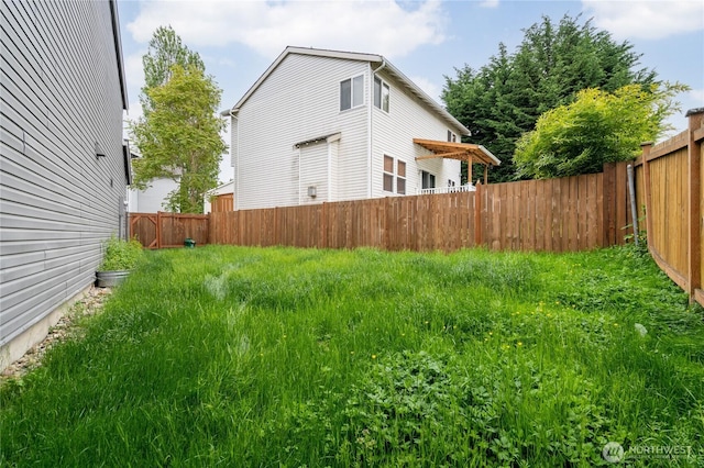 view of yard with a fenced backyard