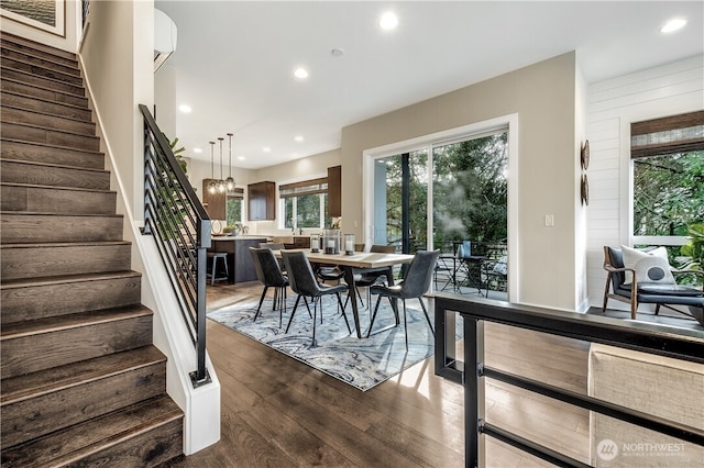 dining space with stairs, dark wood-style floors, and recessed lighting