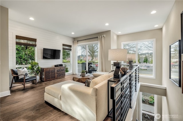 living area featuring wood finished floors and recessed lighting