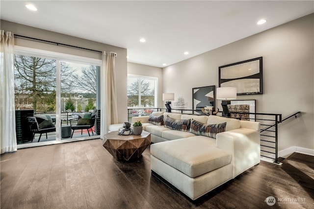 living room with hardwood / wood-style flooring, baseboards, and recessed lighting