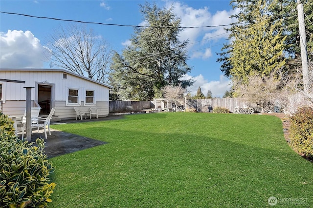 view of yard with a patio area and a fenced backyard