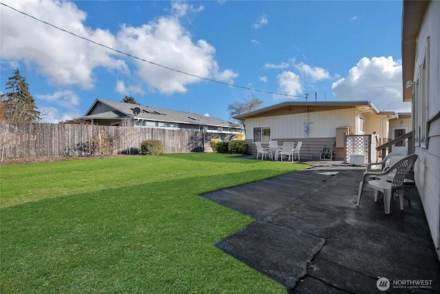 view of yard with a patio area and a fenced backyard