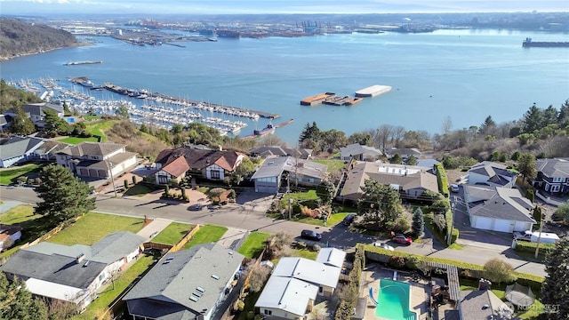 drone / aerial view featuring a water view and a residential view