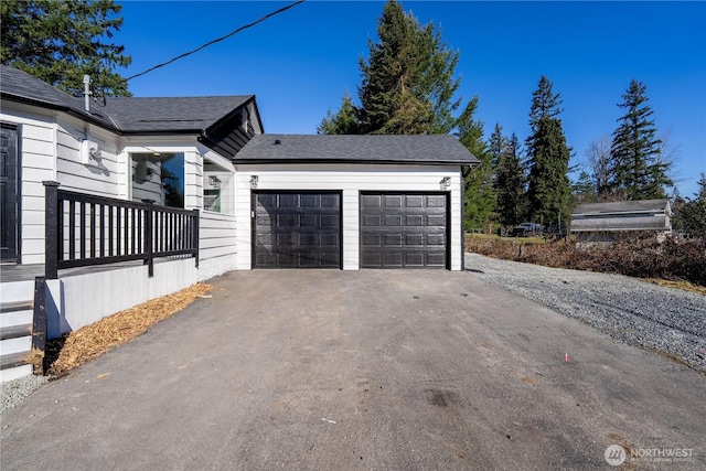 view of home's exterior with driveway and a garage