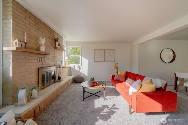 carpeted living room with a fireplace