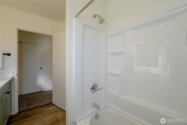 full bathroom with  shower combination, wood finished floors, and vanity