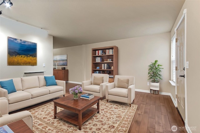 living room with dark wood-style flooring and baseboards