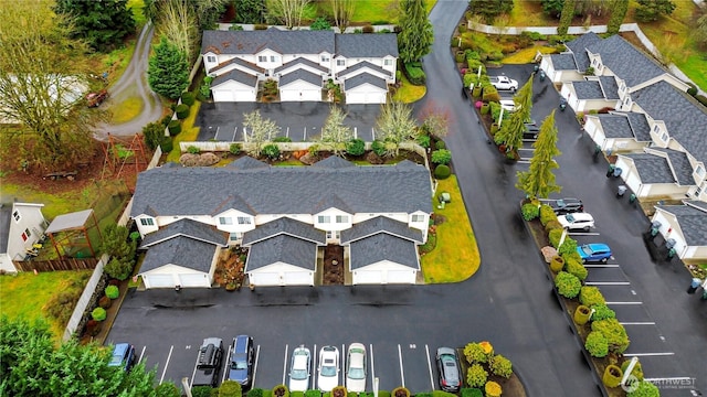 birds eye view of property with a residential view