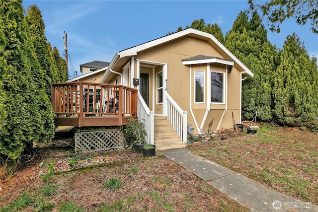 view of front of home with a wooden deck