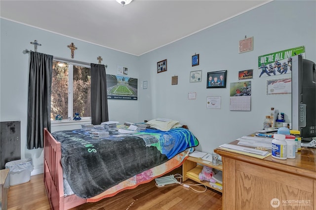 bedroom featuring wood finished floors