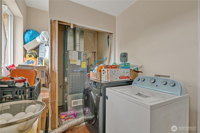 washroom with laundry area and separate washer and dryer