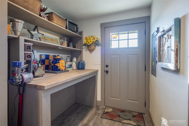 mudroom with wood finished floors