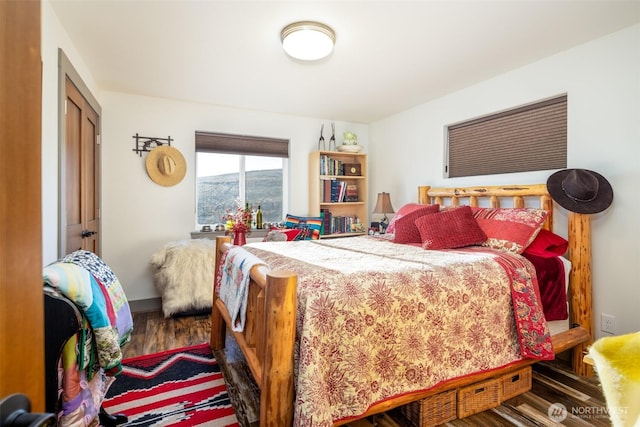 bedroom with wood finished floors