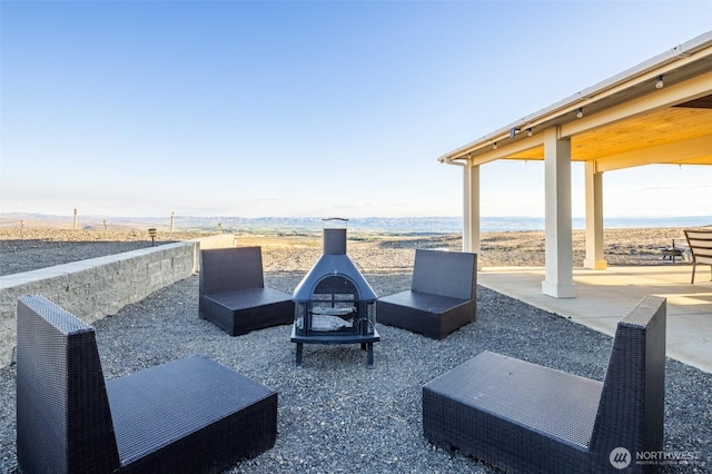 view of patio with an outdoor fire pit