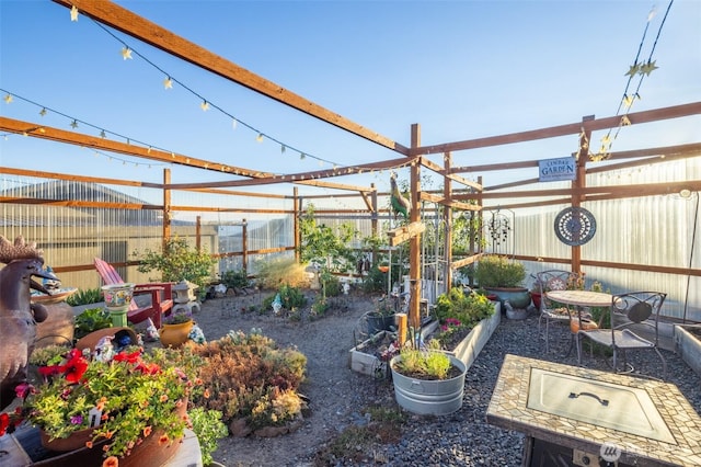 view of yard featuring a vegetable garden and fence