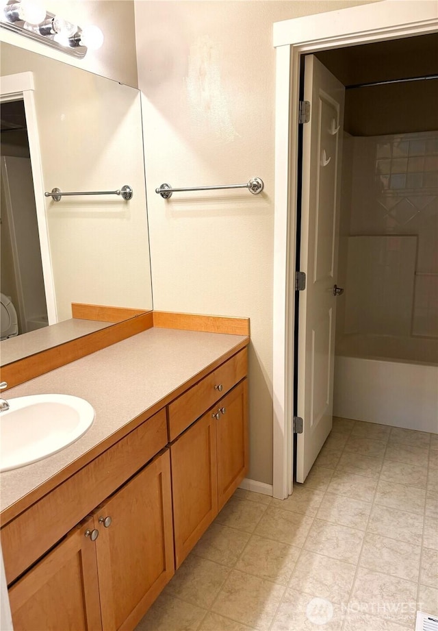 bathroom with shower / bathtub combination and vanity