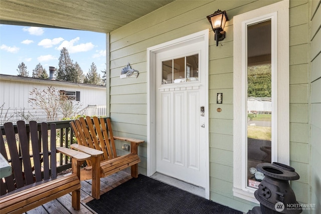 property entrance featuring covered porch