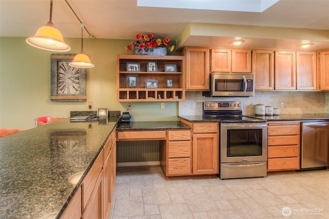 kitchen featuring appliances with stainless steel finishes, decorative backsplash, stone finish flooring, dark stone countertops, and decorative light fixtures