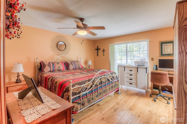 bedroom with ceiling fan and wood finished floors