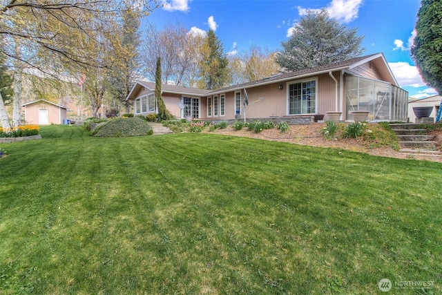 single story home with a front lawn