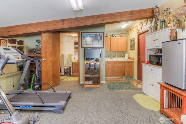 workout area with carpet floors and a sink