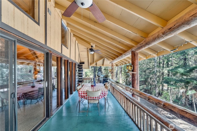 exterior space with a ceiling fan and a balcony