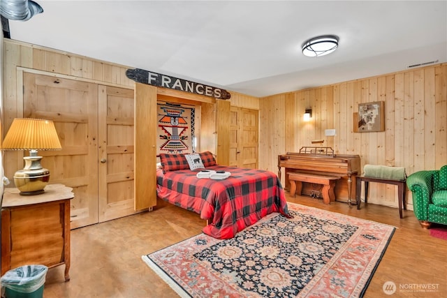 bedroom with wooden walls