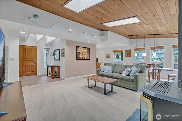 living room with wooden ceiling, recessed lighting, lofted ceiling with skylight, and light colored carpet