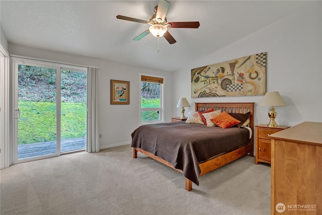 bedroom featuring access to exterior, a ceiling fan, light carpet, vaulted ceiling, and baseboards