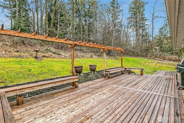 wooden deck featuring a lawn