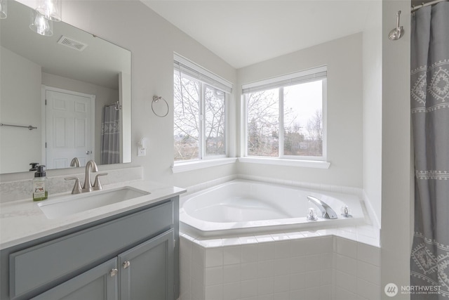 full bath with a bath, visible vents, and vanity