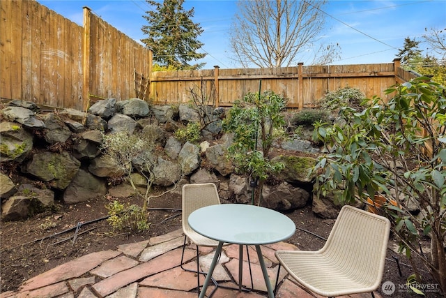 view of patio / terrace with outdoor dining area and a fenced backyard