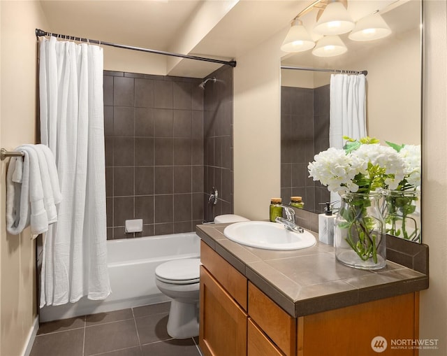 bathroom featuring toilet, vanity, shower / bath combo with shower curtain, and tile patterned floors