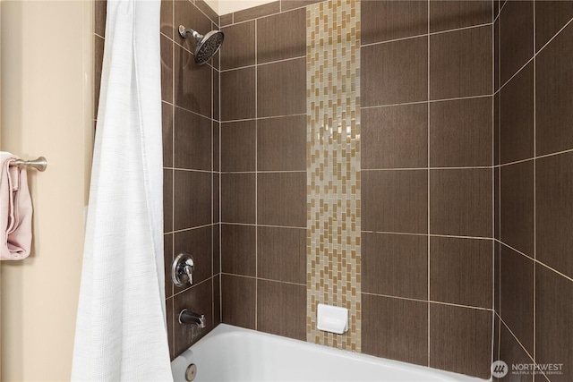 bathroom with shower / bath combo with shower curtain