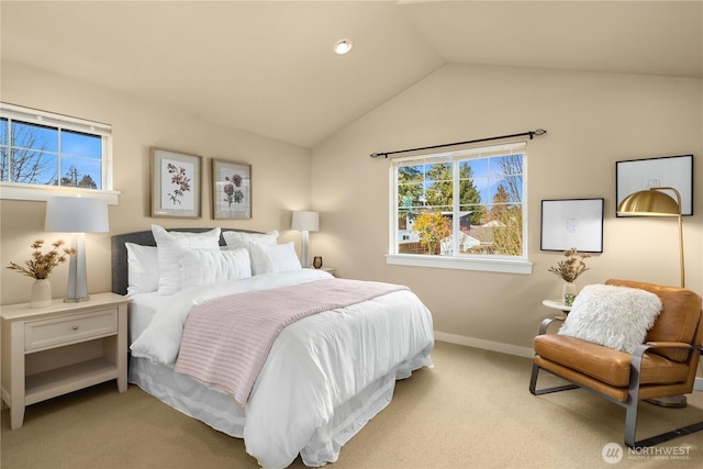 carpeted bedroom with lofted ceiling and baseboards