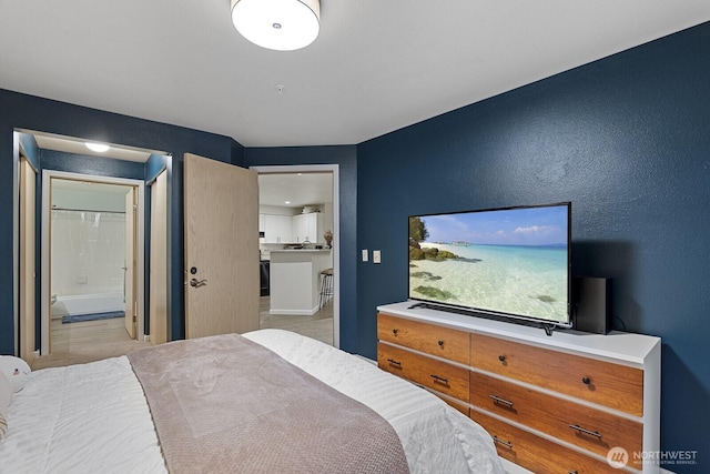 bedroom featuring connected bathroom