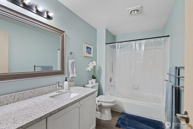 full bathroom with toilet, vanity, shower / tub combo, and wood finished floors