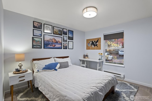 bedroom featuring baseboards, carpet, and a baseboard radiator