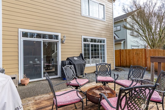 view of patio with a grill and fence