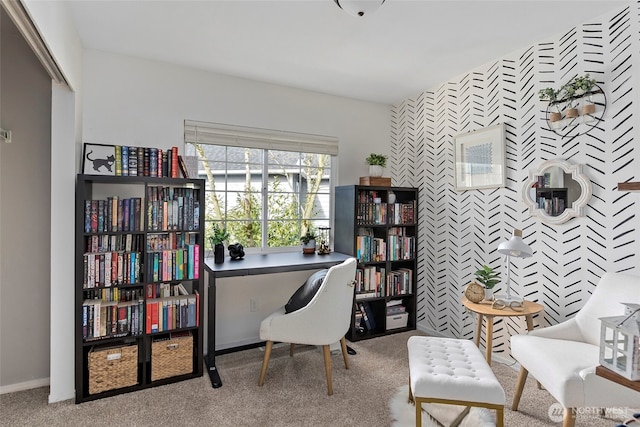 home office with an accent wall, baseboards, and carpet flooring