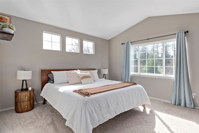 bedroom featuring lofted ceiling, carpet flooring, and baseboards