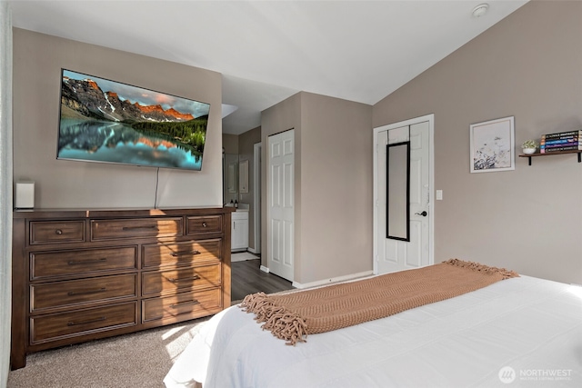 carpeted bedroom featuring vaulted ceiling