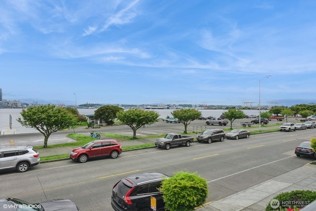 1221 Harbor Ave SW Unit 105, Seattle, WA 98116 - view of asphalt road with sidewalks, street lighting, and curbs