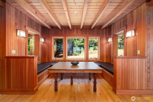 707 NW Thatcher Pass Rd, Decatur Island, WA 98221 - dining area featuring wooden walls, beam ceiling, light wood-style floors, and wood ceiling
